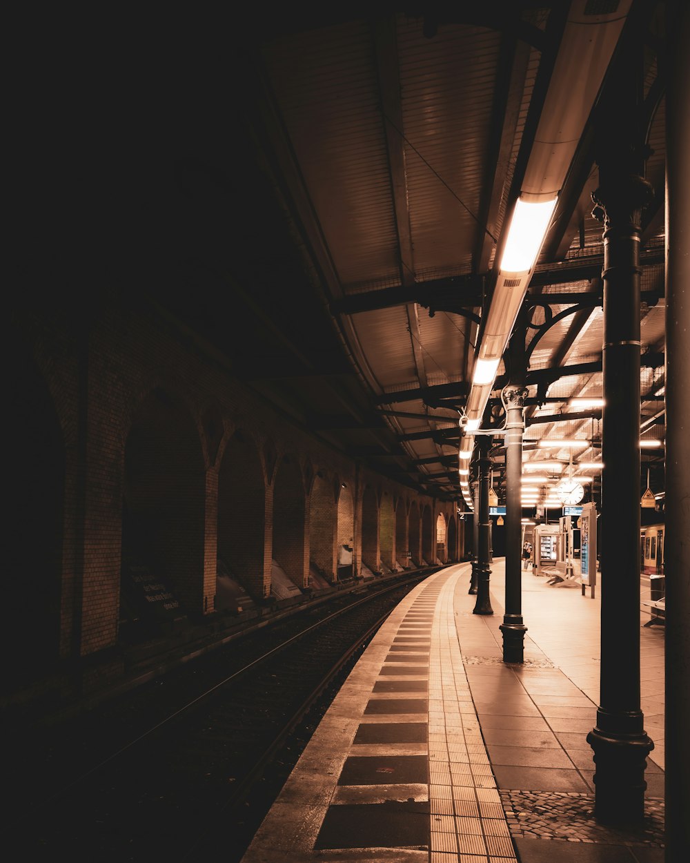 a train station with a train on the tracks