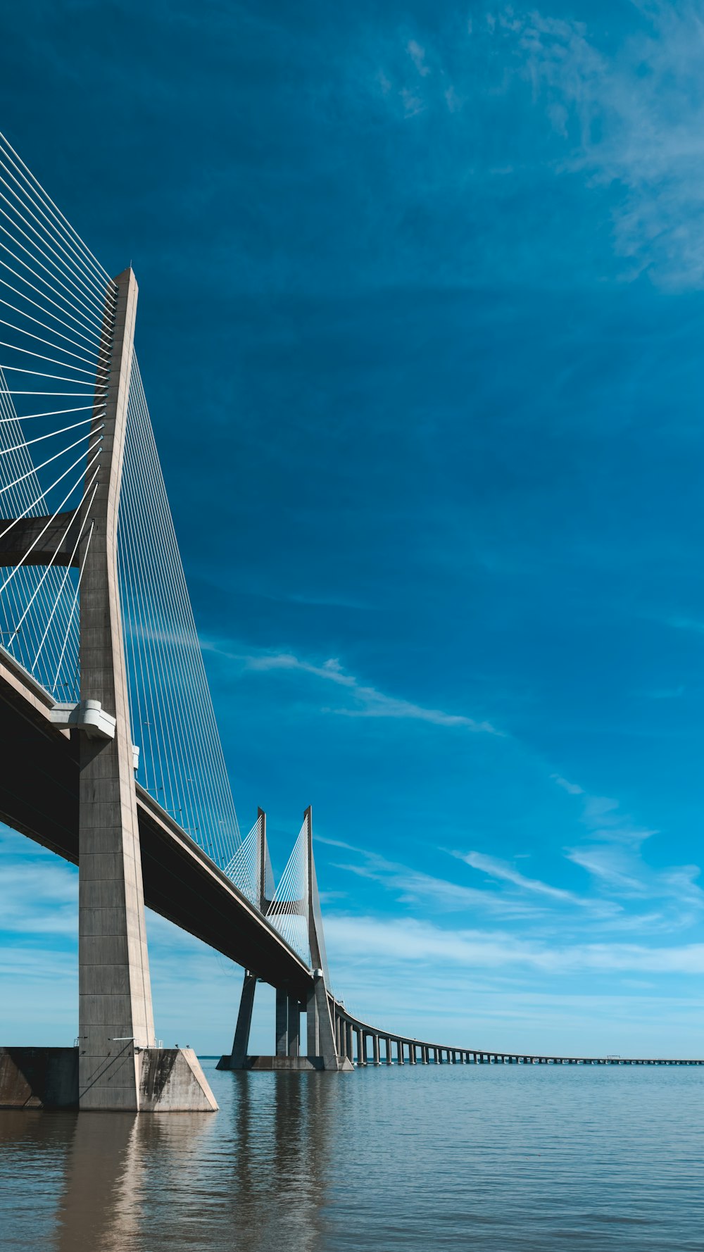 a large bridge spanning over a large body of water