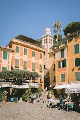 A charming European village with cobblestone streets and cozy cafes bustling with visitors.