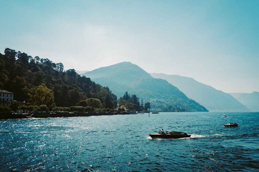 a small boat in the middle of a large body of water