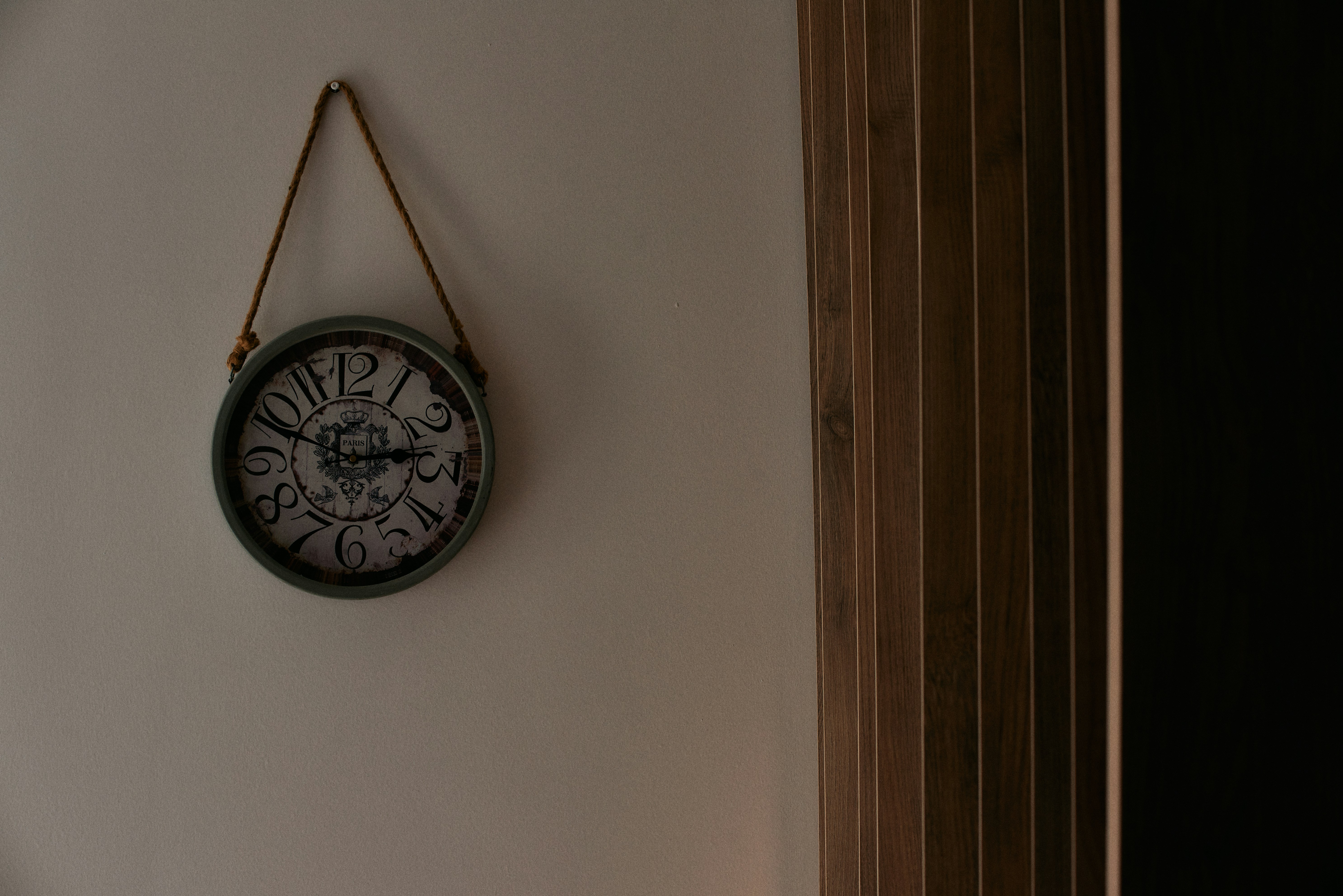 a clock hanging on the wall of a room