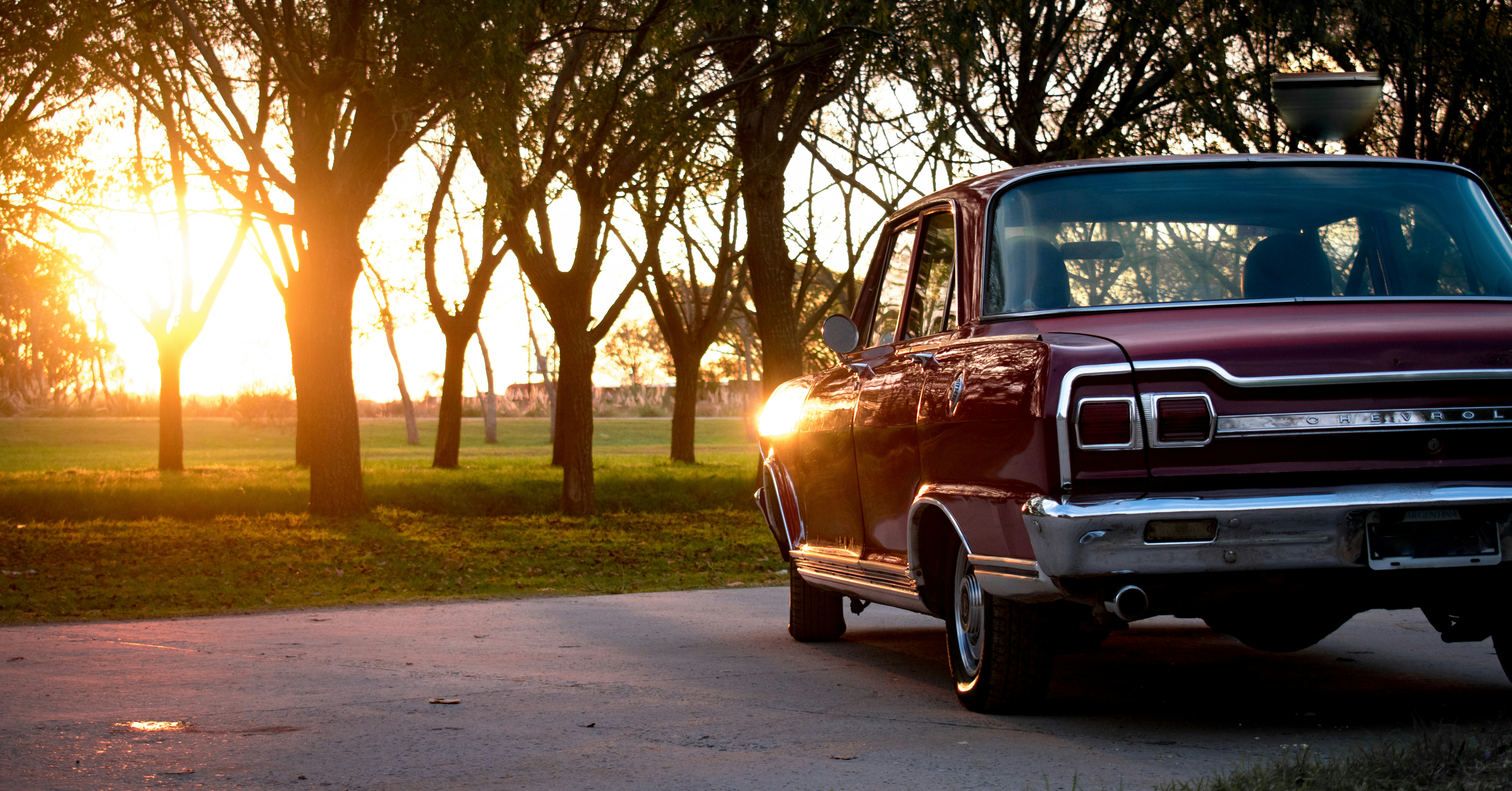 a red truck parked on the side of a road