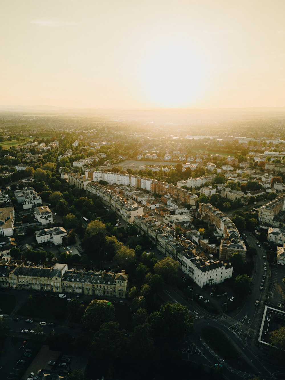 an aerial view of a city at sunset