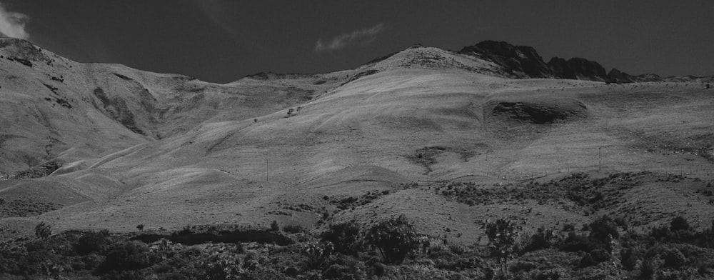 a black and white photo of a mountain range