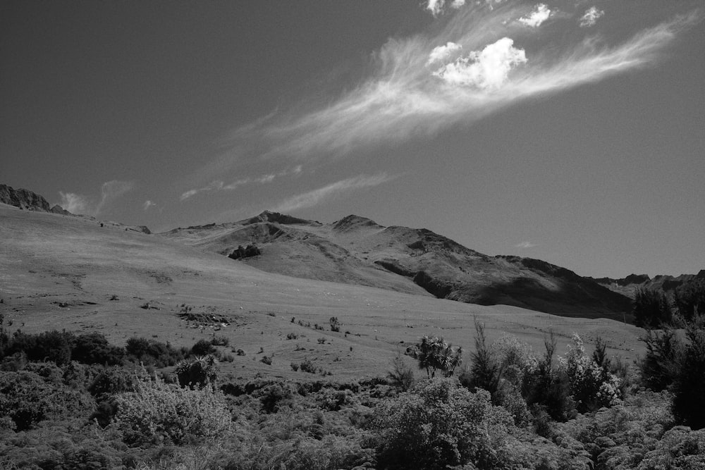 a black and white photo of a mountain range