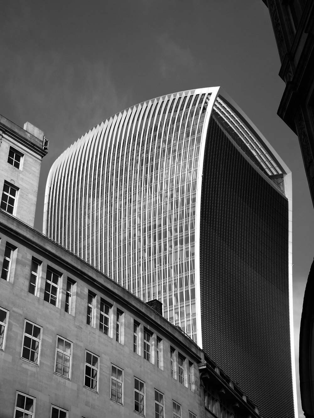 a black and white photo of a tall building