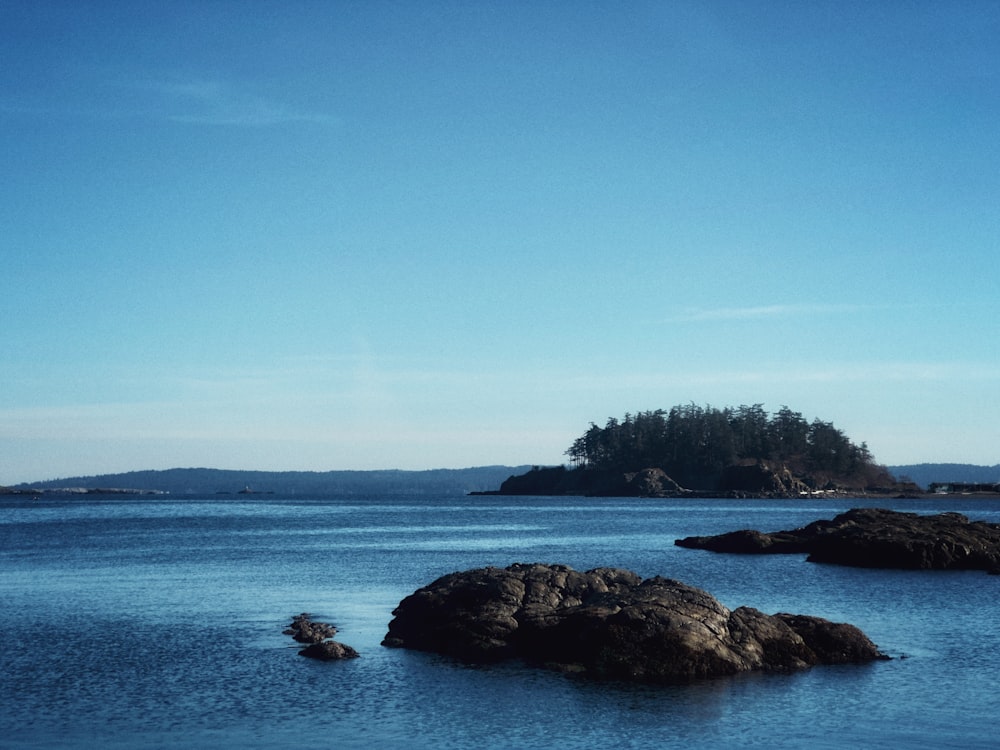 a body of water with a small island in the distance