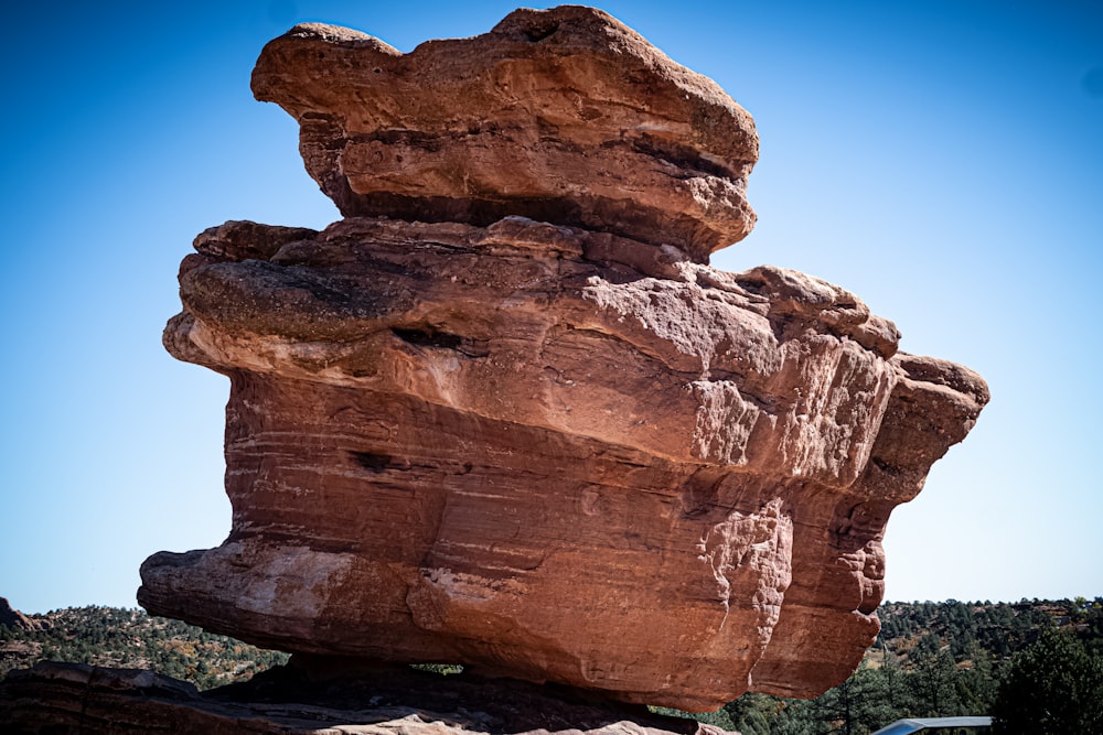 a large rock formation in the middle of a desert