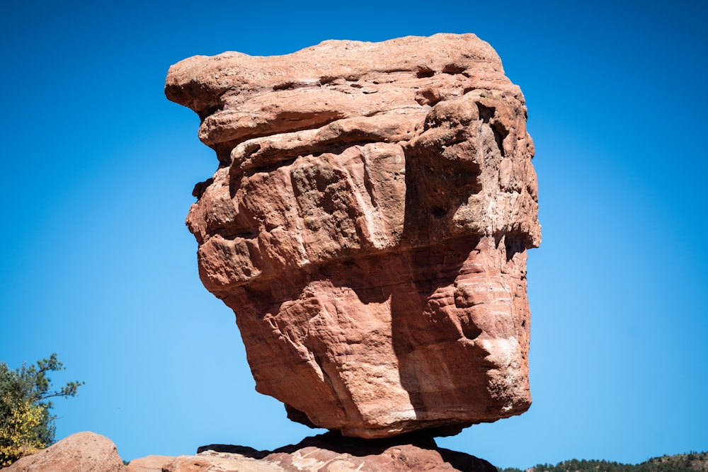 a large rock formation in the middle of a desert