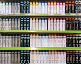 Shelves filled with soaps, shampoos, and personal hygiene products in bright packaging.
