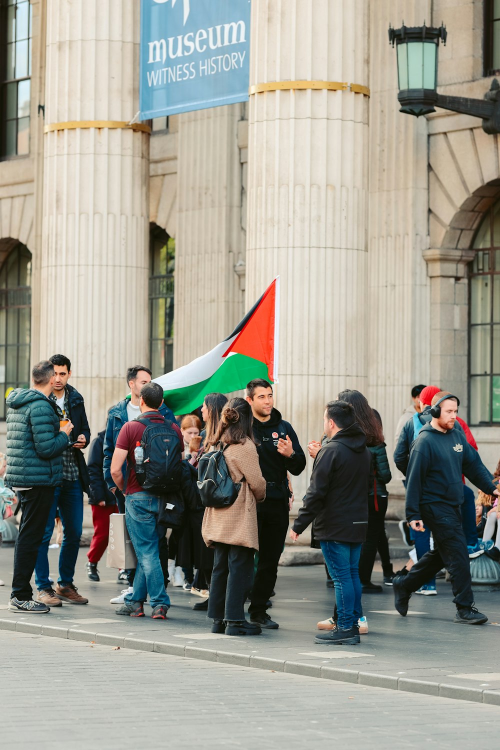 a group of people standing in front of a building