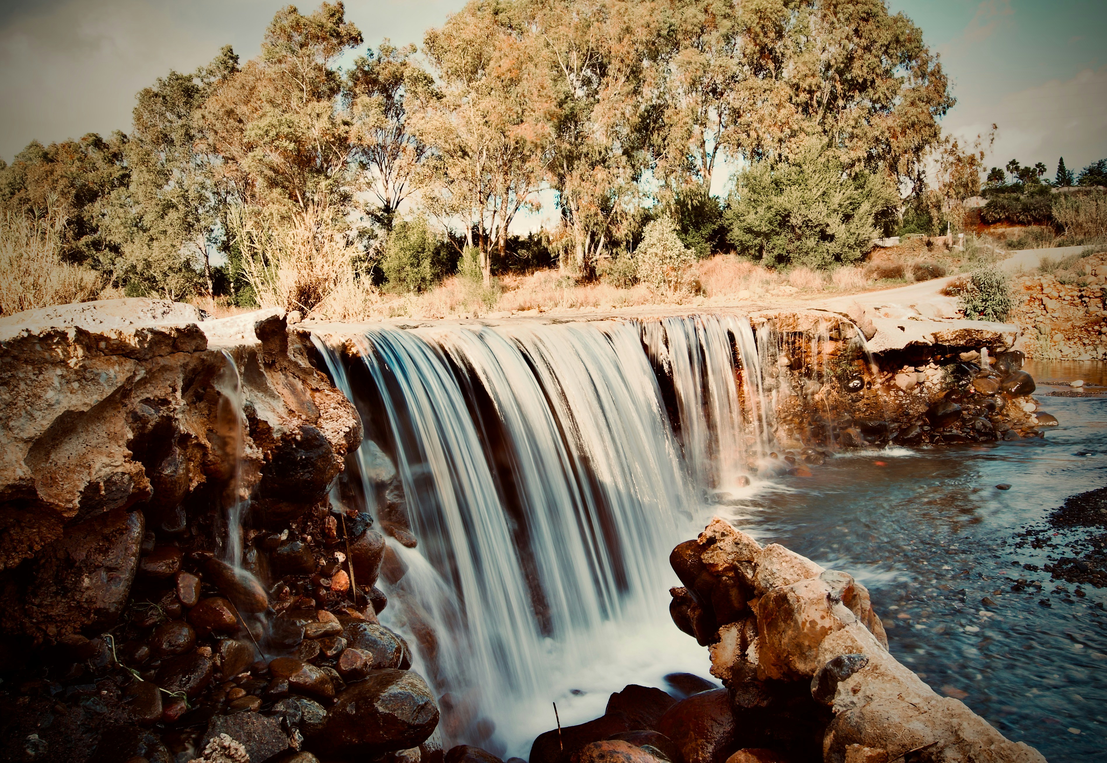 a large waterfall with lots of water coming out of it