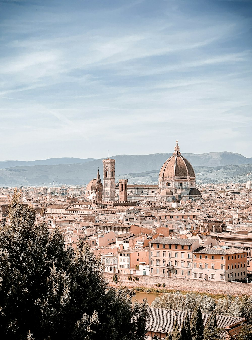 a view of a city from a hill