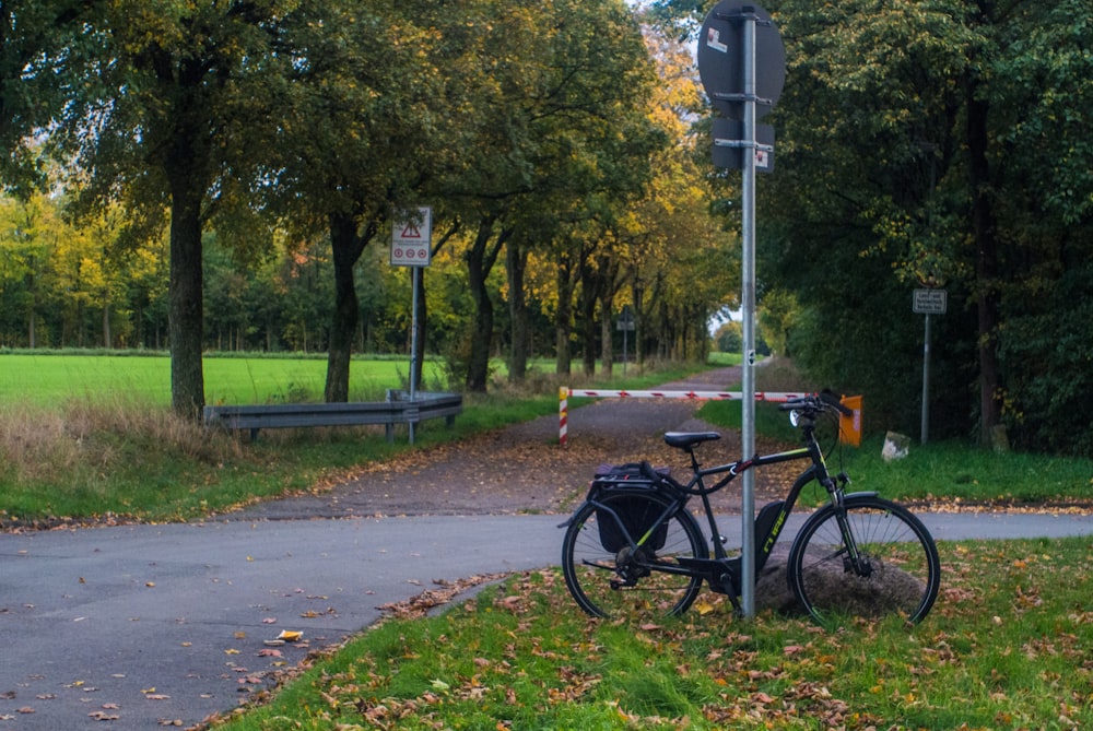 a bicycle parked on the side of a road