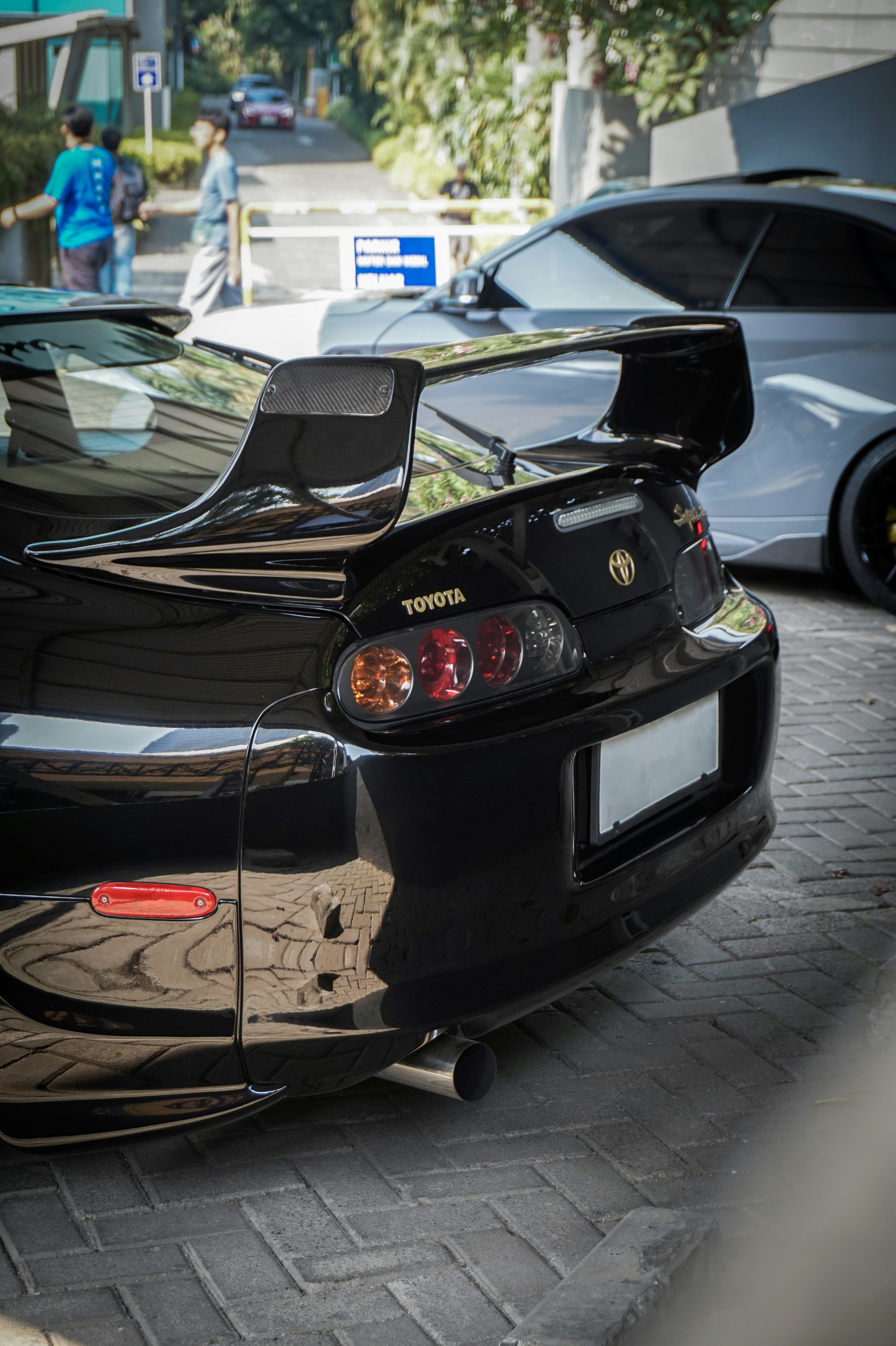 a black sports car parked on the side of the road