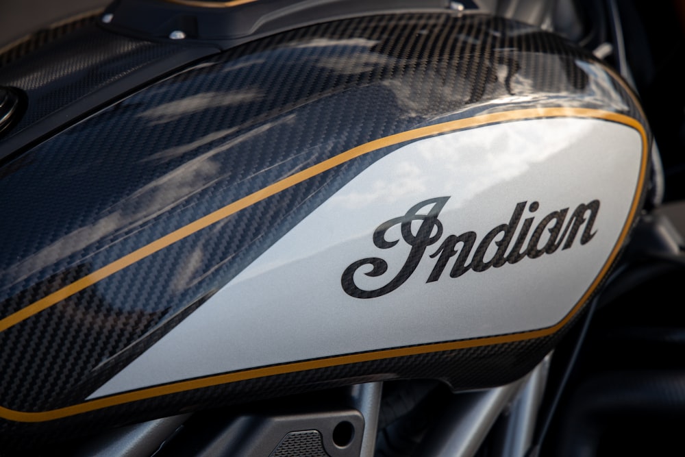 a close up of a motorcycle with the name indian on it