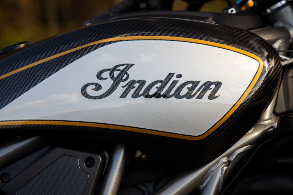 a close up of the indian logo on a motorcycle