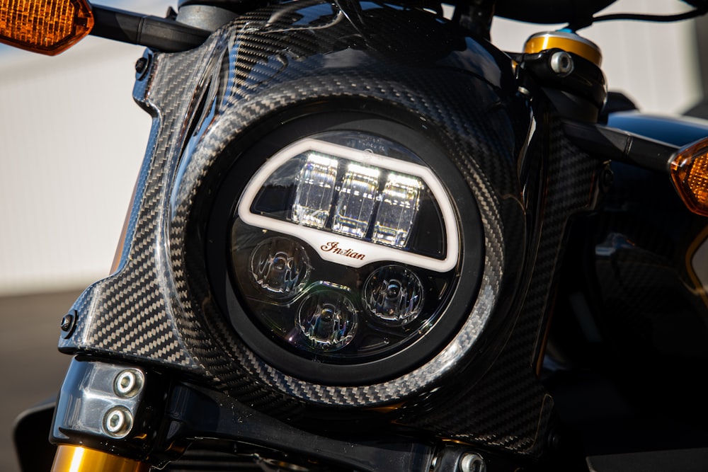 a close up of a motorcycle's front light