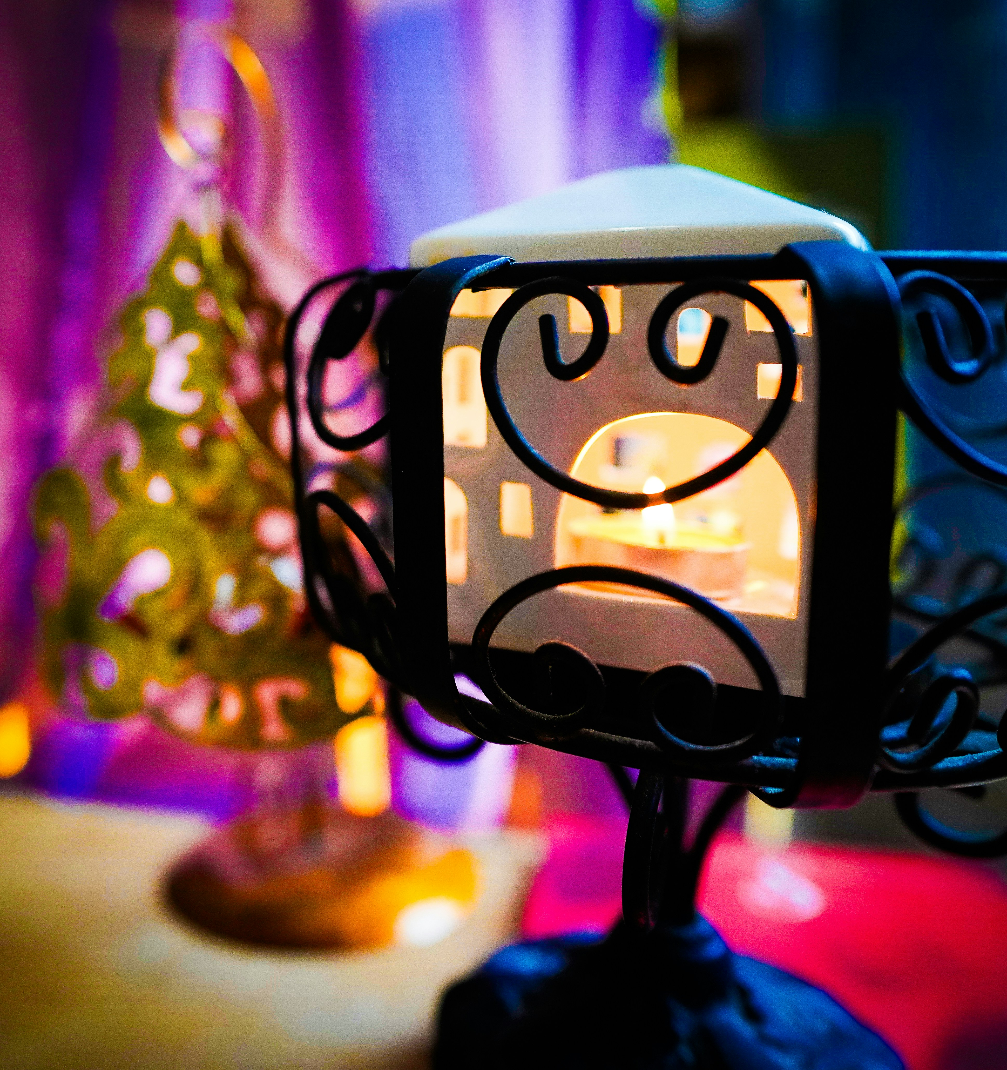 a lit candle sitting on top of a table