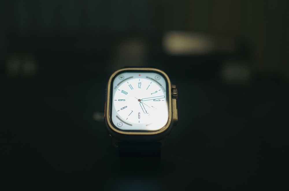 a close up of a watch on a table