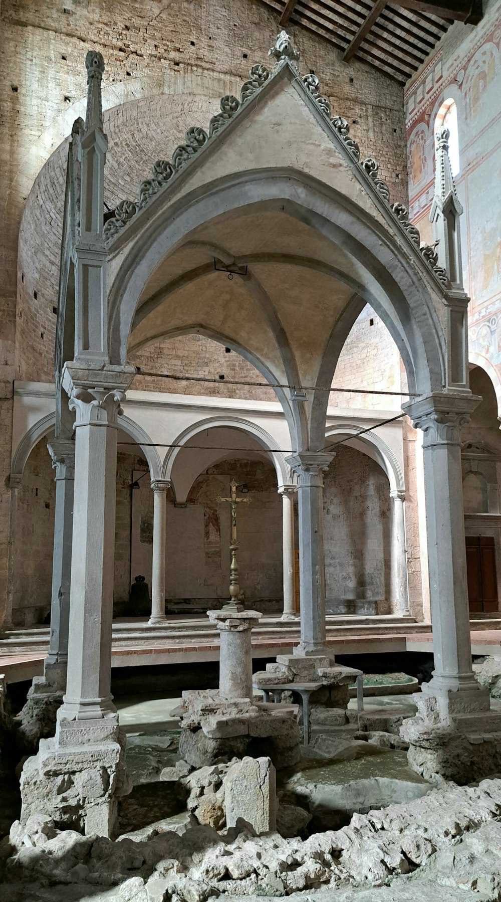 an old church with a stone alter and pillars