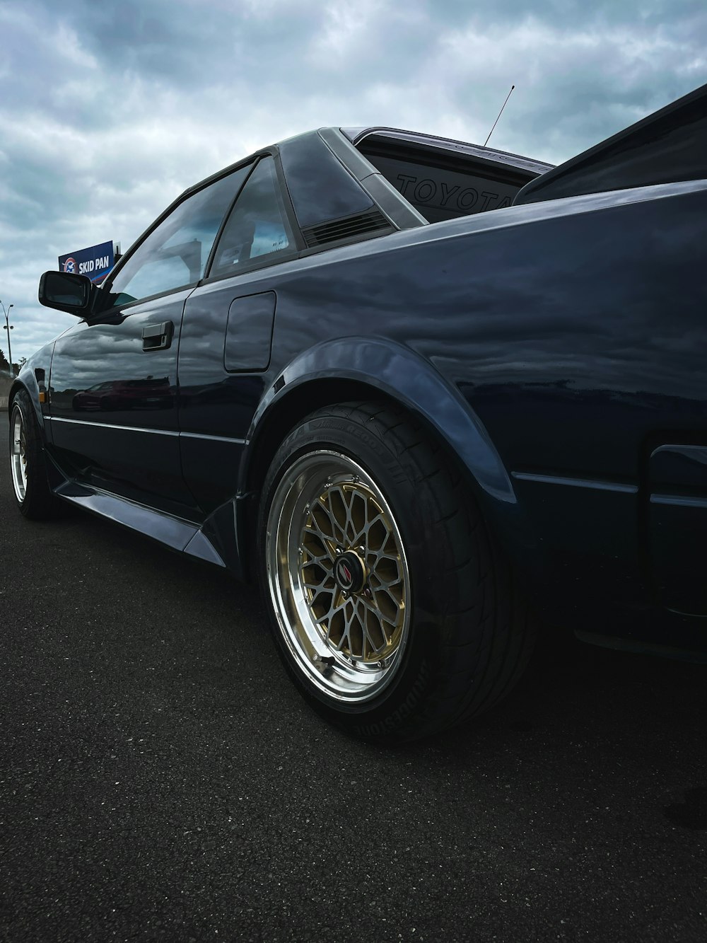 a close up of a car parked in a parking lot