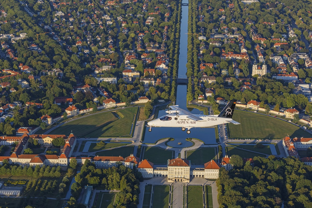 an aerial view of a plane flying over a city