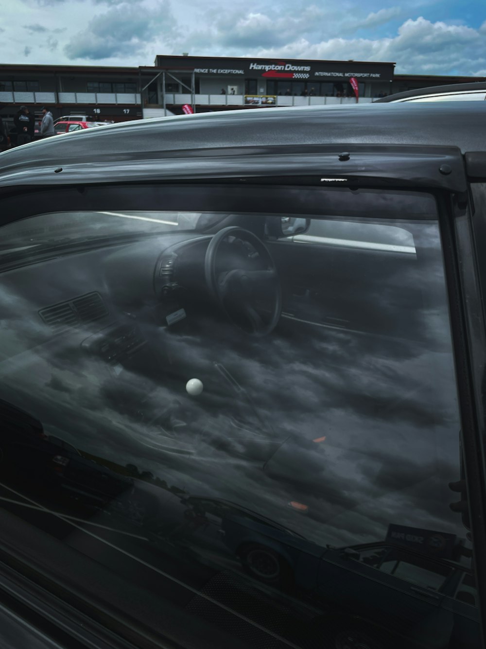 a car is parked in front of a building