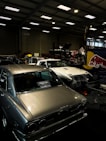 a garage filled with lots of old cars