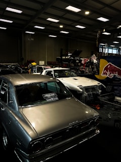 a garage filled with lots of old cars