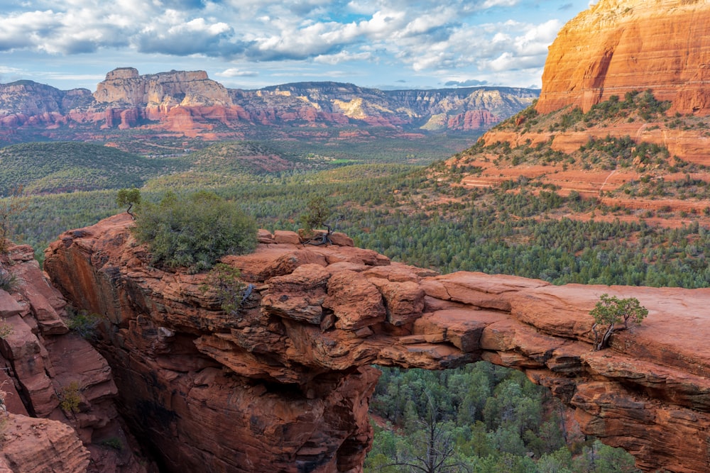 a scenic view of a valley and mountains