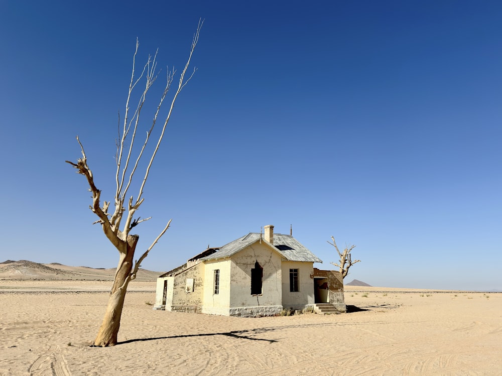 a small house in the middle of a desert