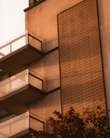 Modern townhouse exterior bathed in warm afternoon light