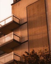 A modern building facade at 125 Cherry Street bathed in warm afternoon light.