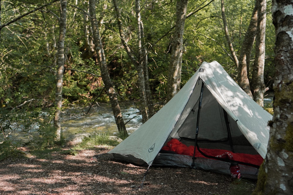 a tent is pitched up in the woods