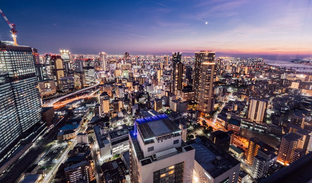 a view of a city at night from the top of a building