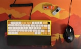 A variety of colorful mouse pads arranged on a desk.