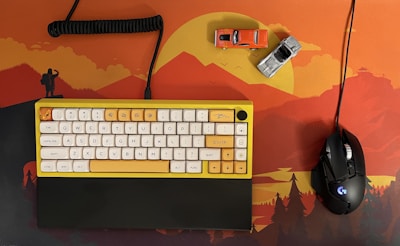 A variety of colorful mouse pads arranged on a desk.