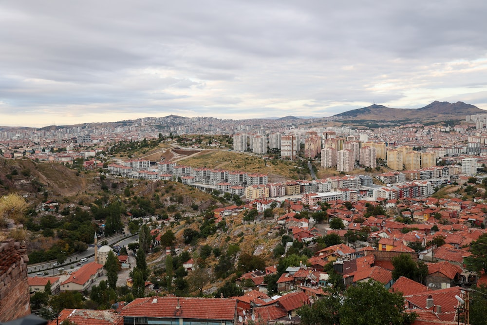 a view of a city from the top of a hill