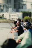 Participants casting their lines during a fishing competition.