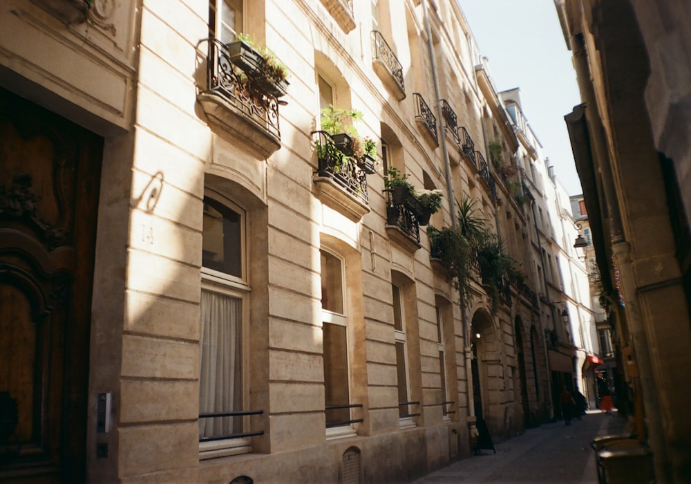 a narrow city street lined with tall buildings