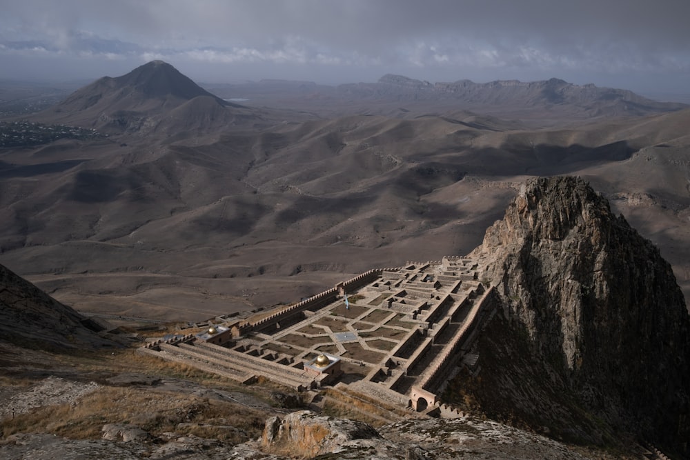 a large stone structure sitting on top of a mountain