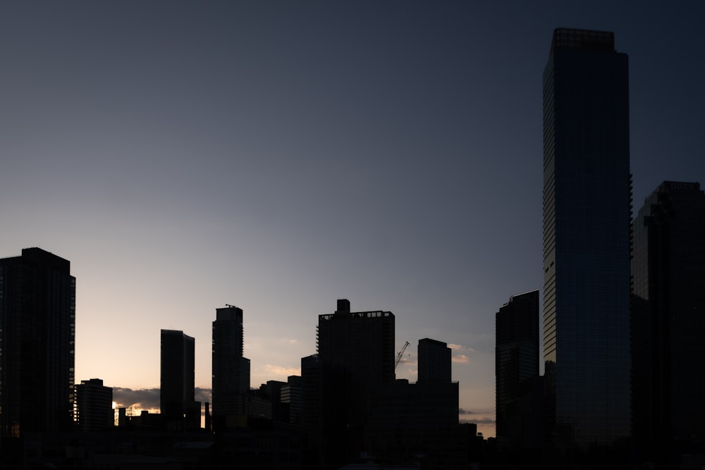 a view of a city skyline at sunset