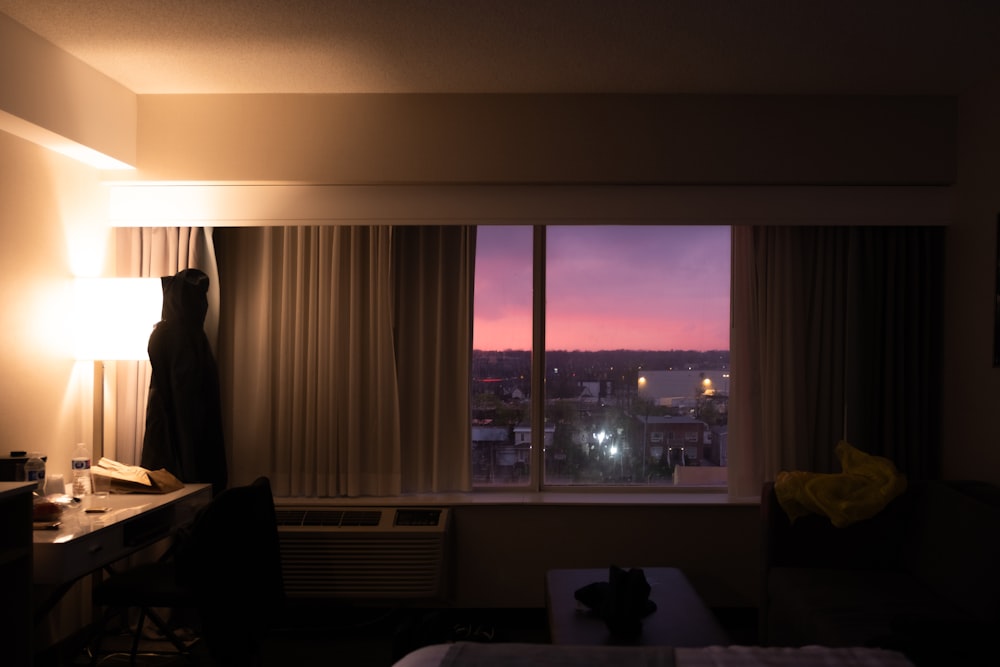 a hotel room with a view of the city