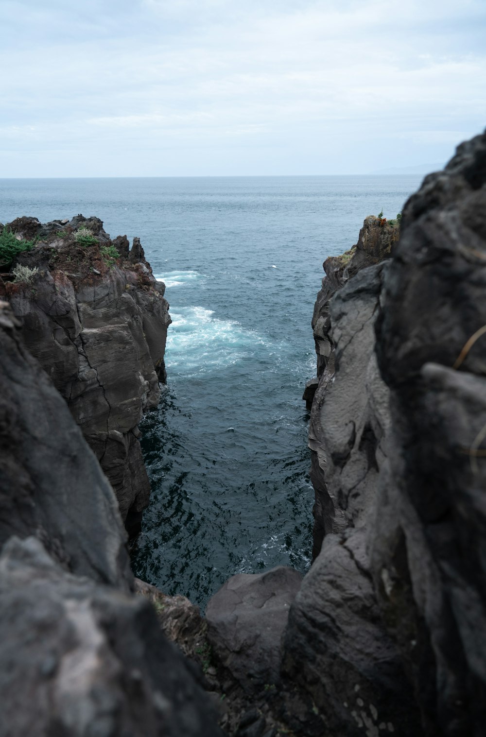 a view of a body of water from a cliff