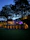 Elegant modern villa exterior with warm lighting at dusk, showcasing premium design and craftsmanship.