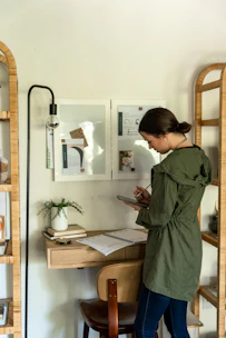 A student using a tablet to take a practice test in a cozy study nook.