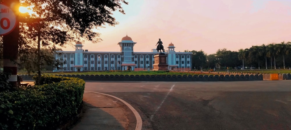 a large building with a clock tower in front of it