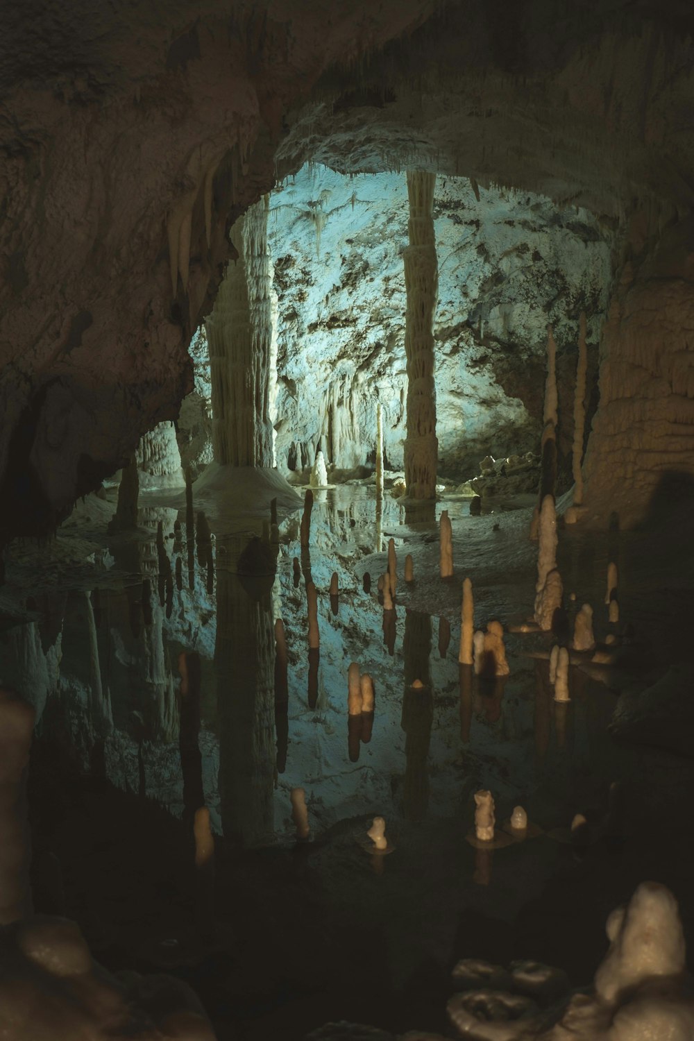 a cave filled with lots of water and rocks