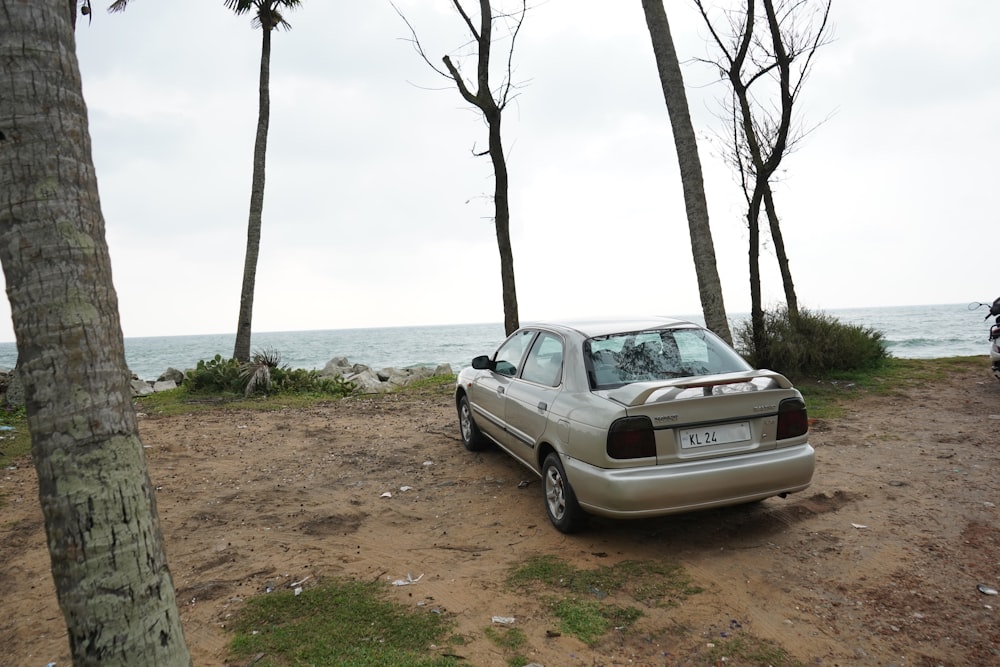 a car parked on the side of a dirt road